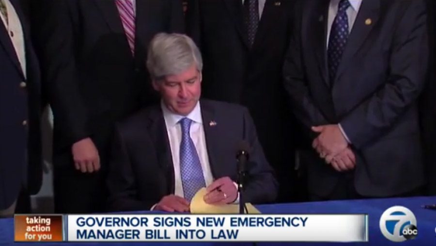 Michigan Governor Rick Snyder signing emergency manager bill into law